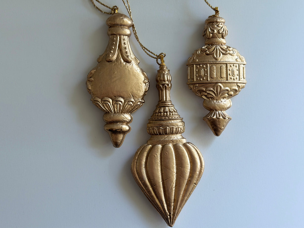 Three gold Baubles Mould (2026 Limited Release) by I.O.D. ornaments with ornate patterns.
