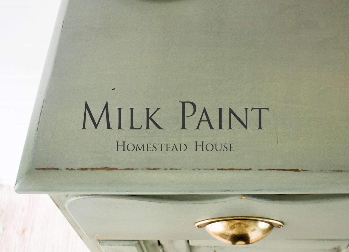 Green wooden dresser with brass handle, finished in Acadia Pear Milk Paint by Homestead House.