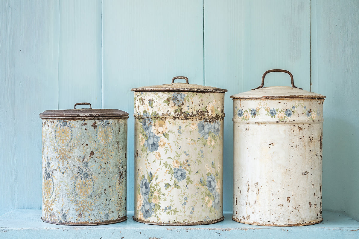 Three I.O.D. Alfred Peats & Co. Paint Inlays with a faded vintage floral design on a soft blue background.