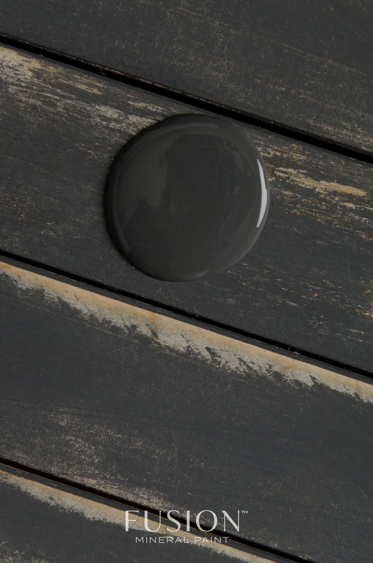 Ash Fusion Mineral Paint drop on wood slats, Fusion Mineral Paint logo at bottom center.