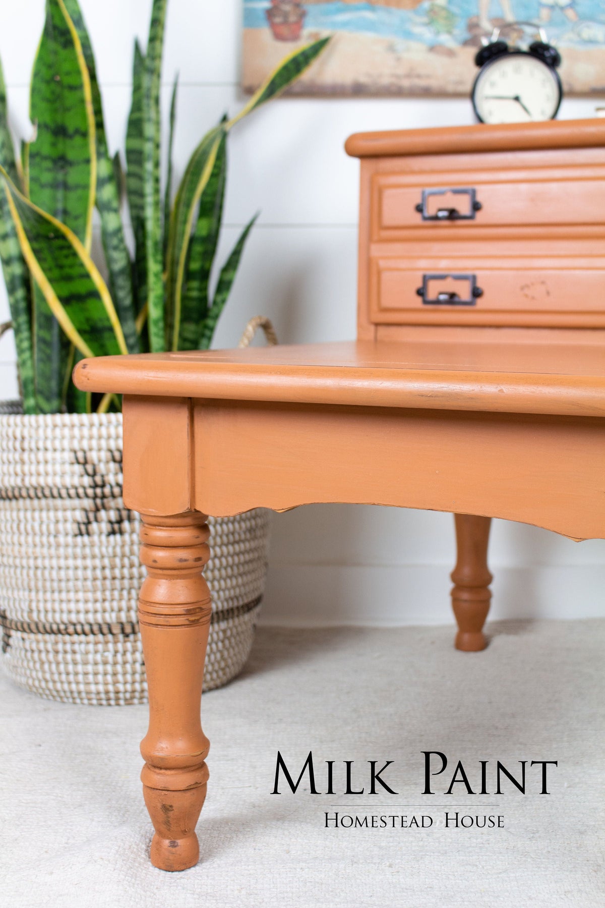 Orange wooden table with “Autumn Leaves Milk Paint by Homestead House” text at the bottom.