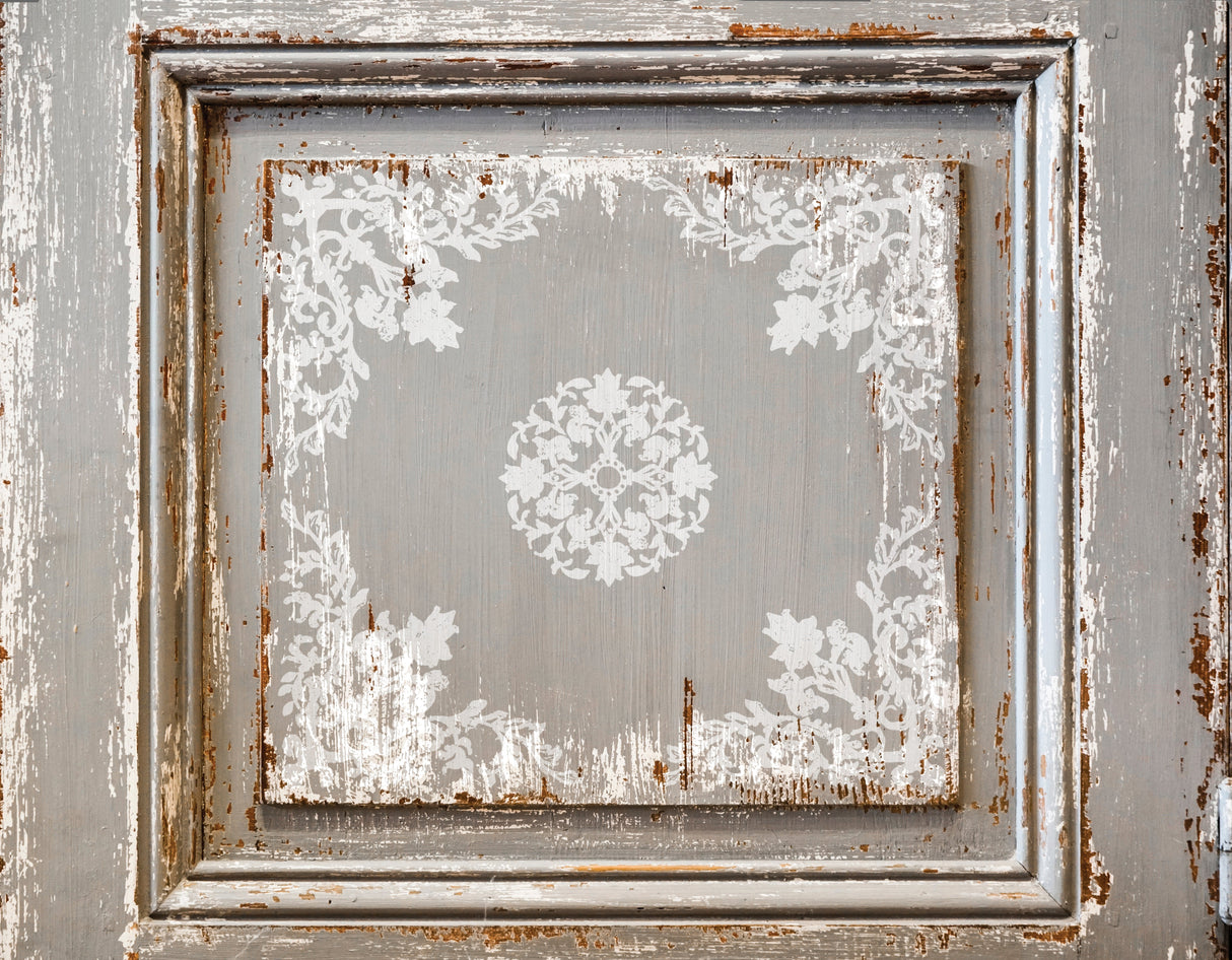 Distressed wood featuring faded white florals created with I.O.D. Bella Stamp (Retired) by Iron Orchid Designs.