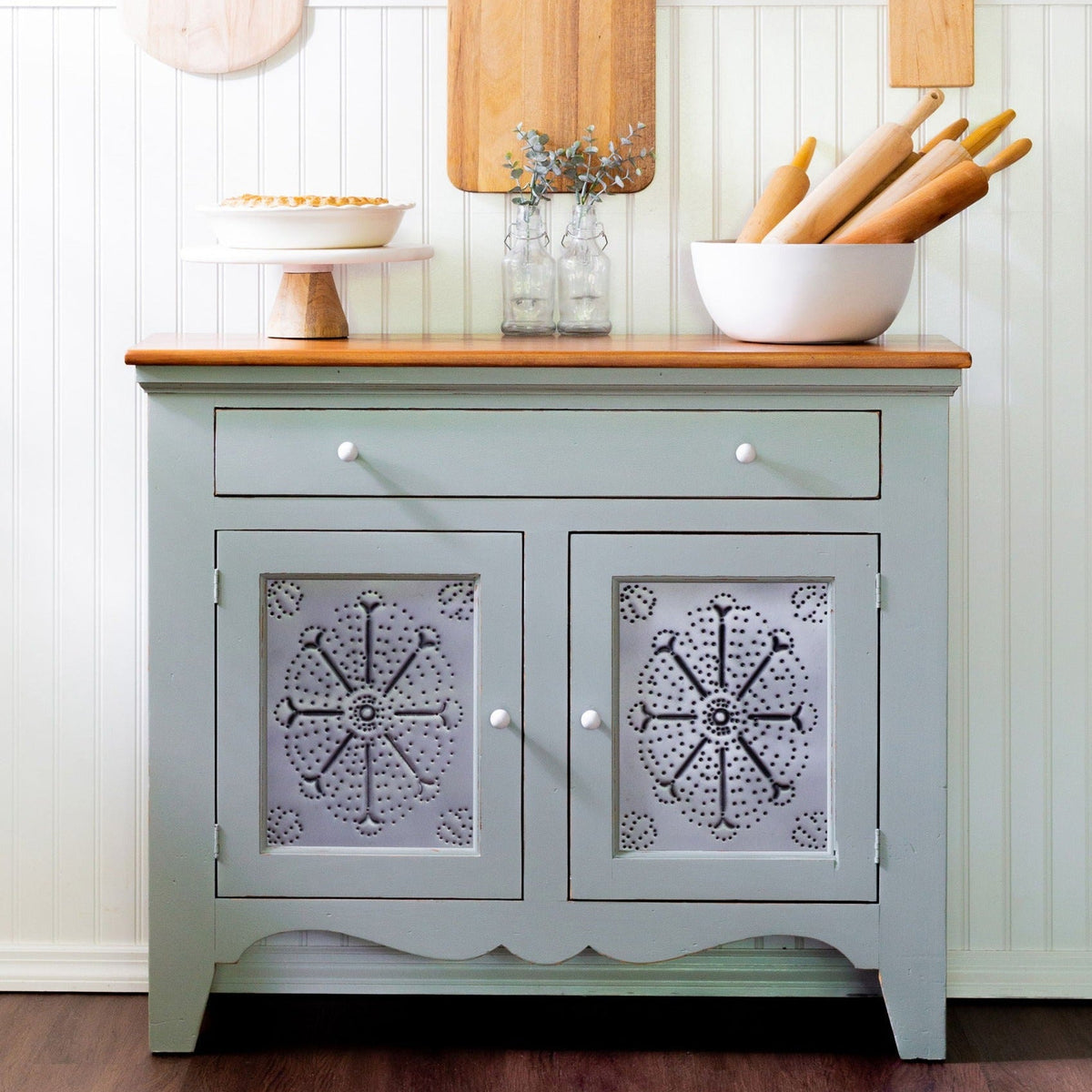 Bellwood Fusion Mineral Paint cabinet with wood top, pie on a stand, and bowl with rolling pins on countertop.