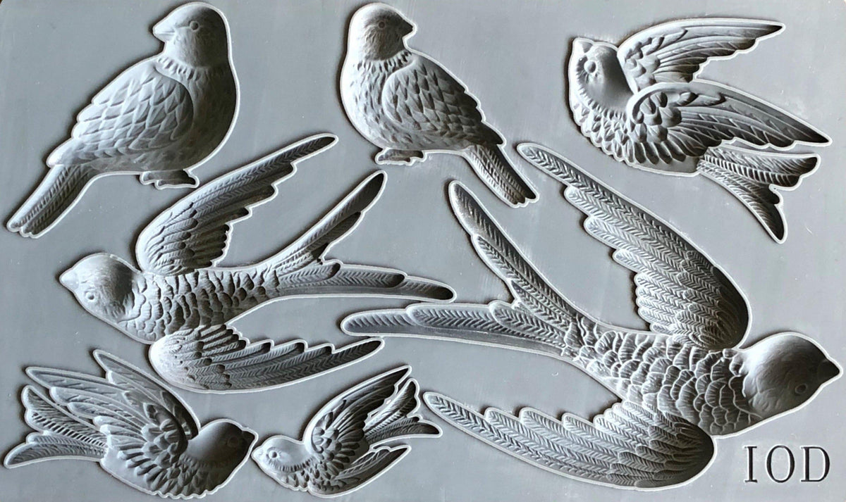 Gray silicone I.O.D. Birdsong Mould featuring 7 bird designs for Iron Orchid Designs décor projects.
