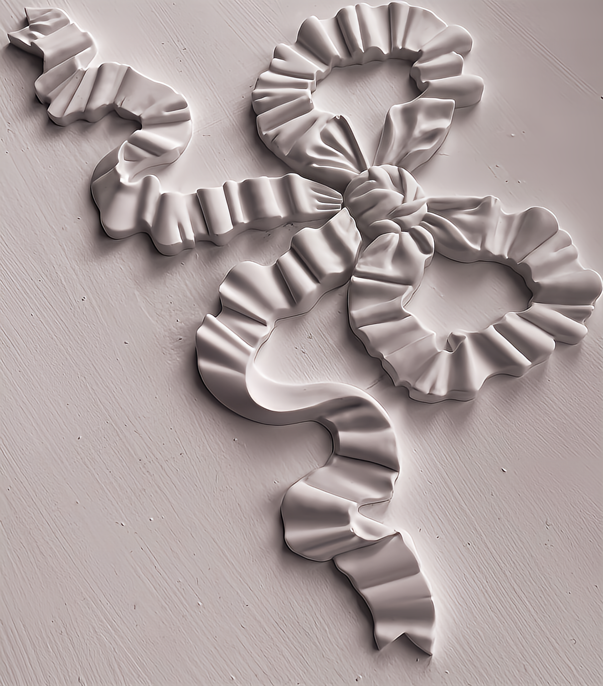Ruffled bow made with Bows Mould by IOD, displayed flat on a light surface.