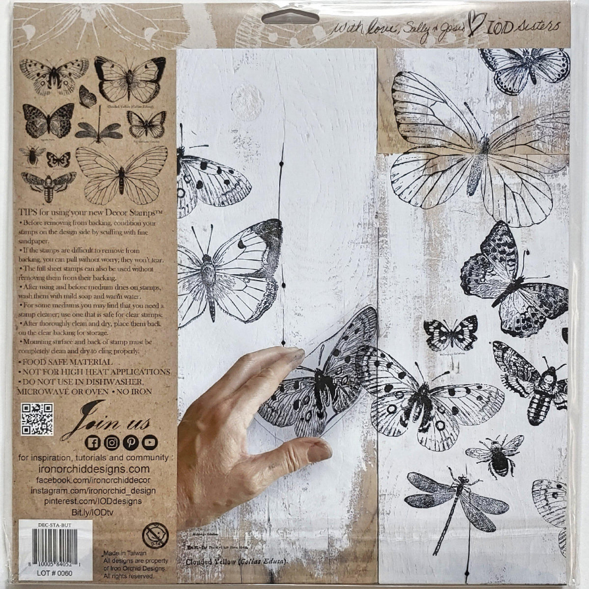 Hand displaying prints made with IOD Butterflies Stamp using reusable stamping masks from Iron Orchid Designs.