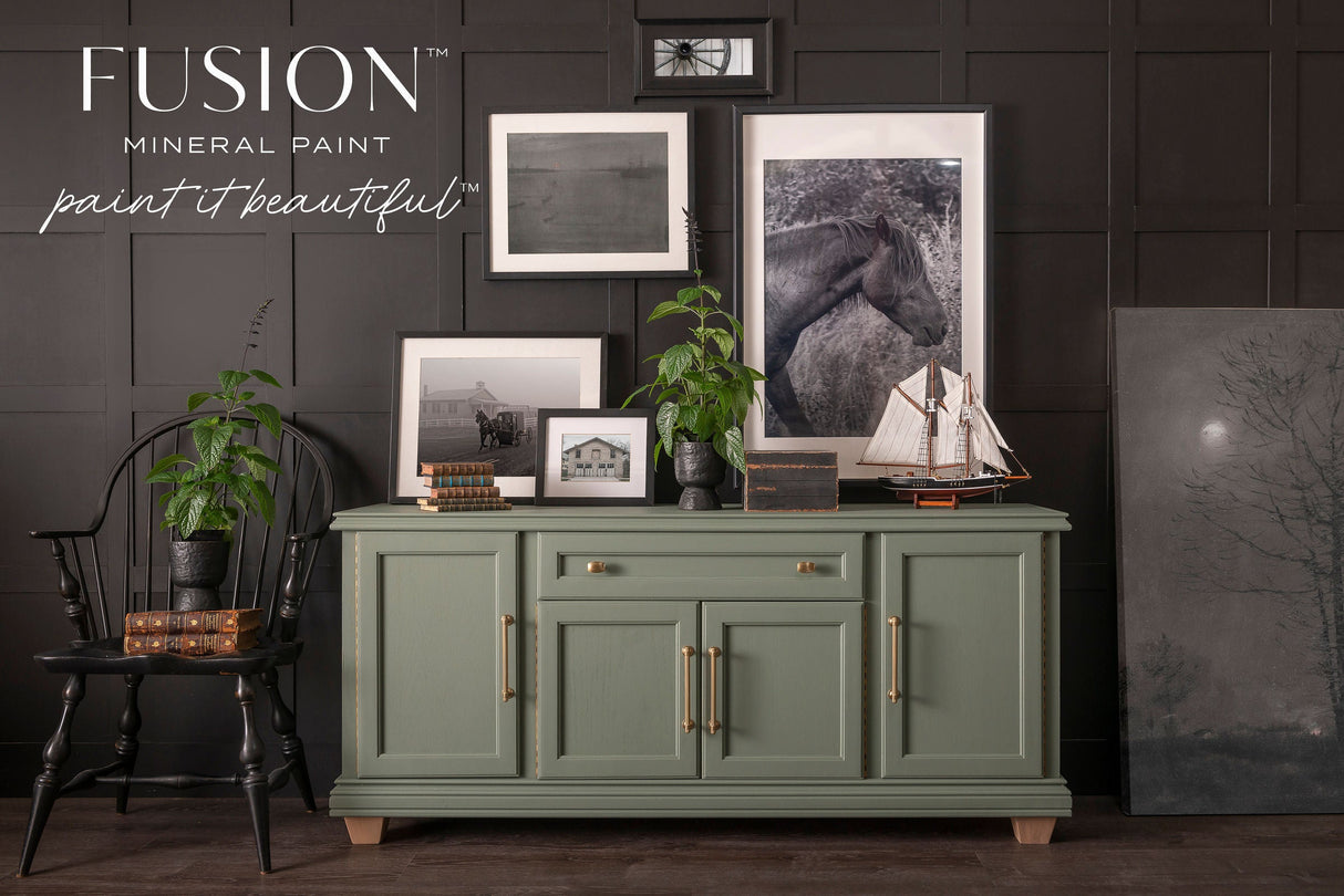 Green sideboard painted in Carriage House Fusion Mineral Paint, shown with decor items on top.