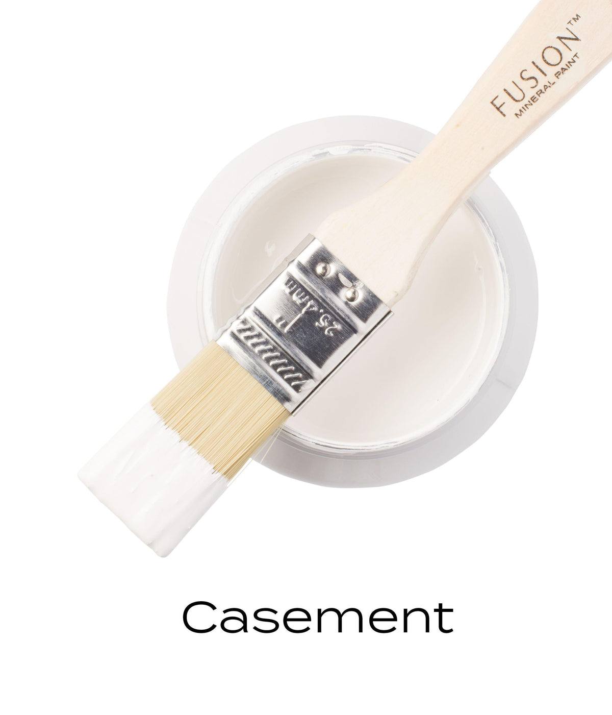Brush with white paint resting on open jar of Casement Fusion Mineral Paint by Fusion Mineral Paint.
