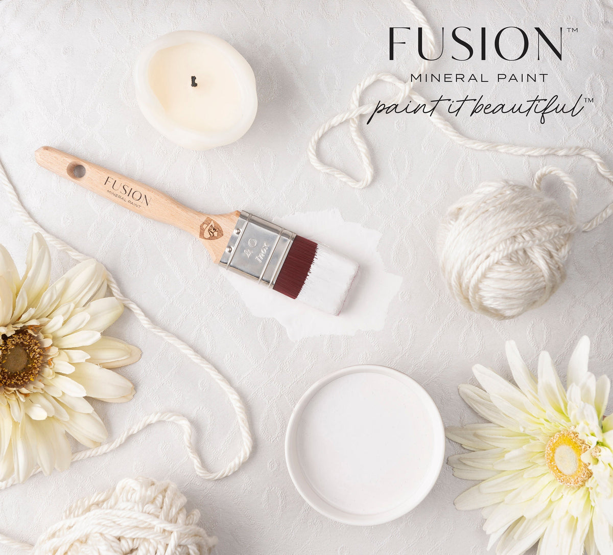 Fusion Mineral Paint Cashmere and essentials arranged on a textured white surface.