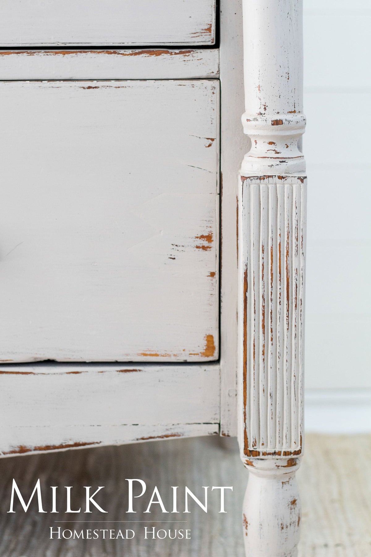 Cathedral Taupe Milk Paint by Homestead House displayed on a white distressed dresser leg, brand name bottom left.