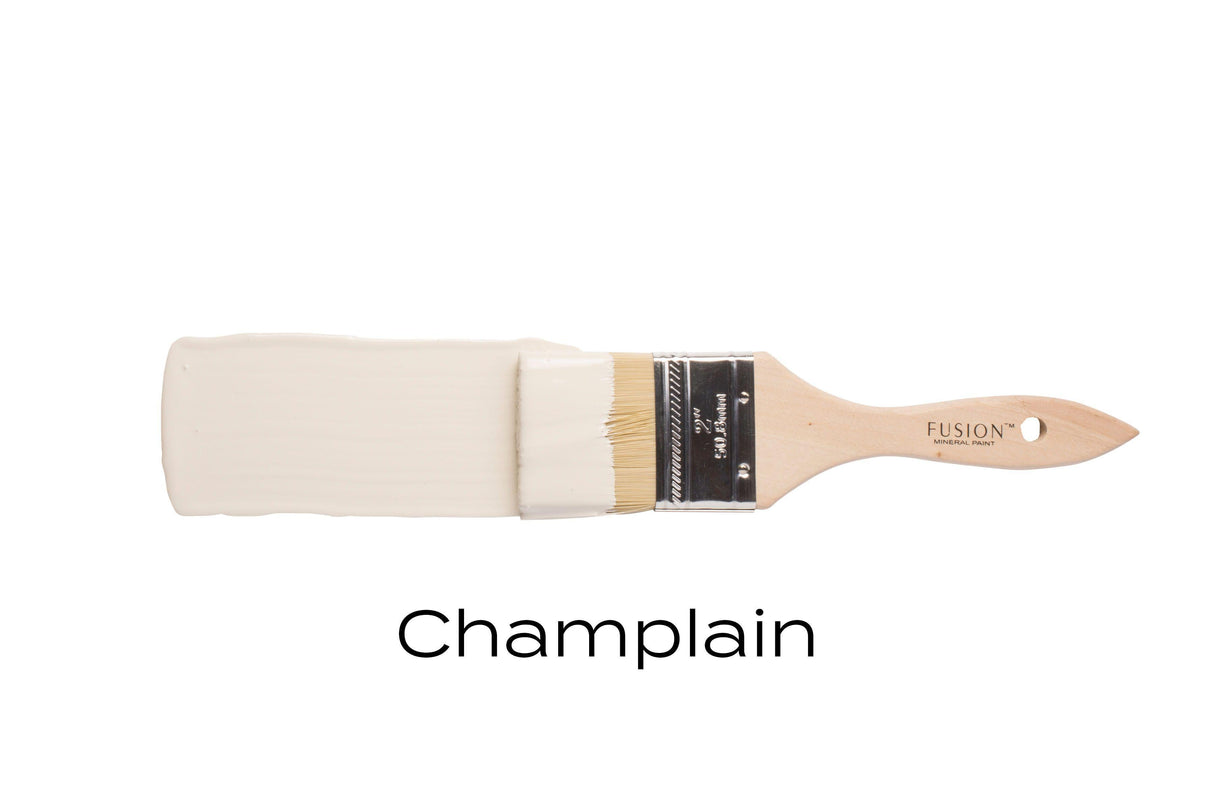 Champlain Fusion Mineral Paint in warm white shown with a paintbrush.