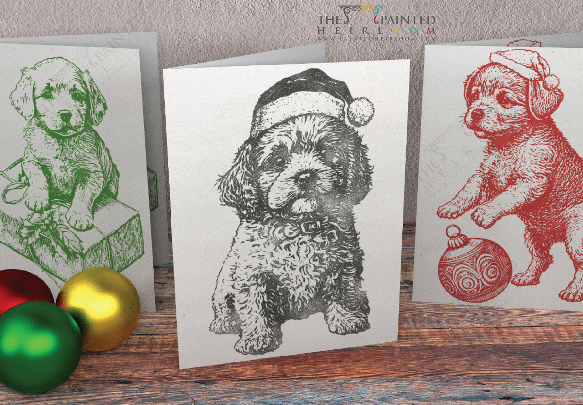 Set of 3 holiday cards with I.O.D. Christmas Pups Stamp (2023), dogs in Santa hats among ornaments on wood.