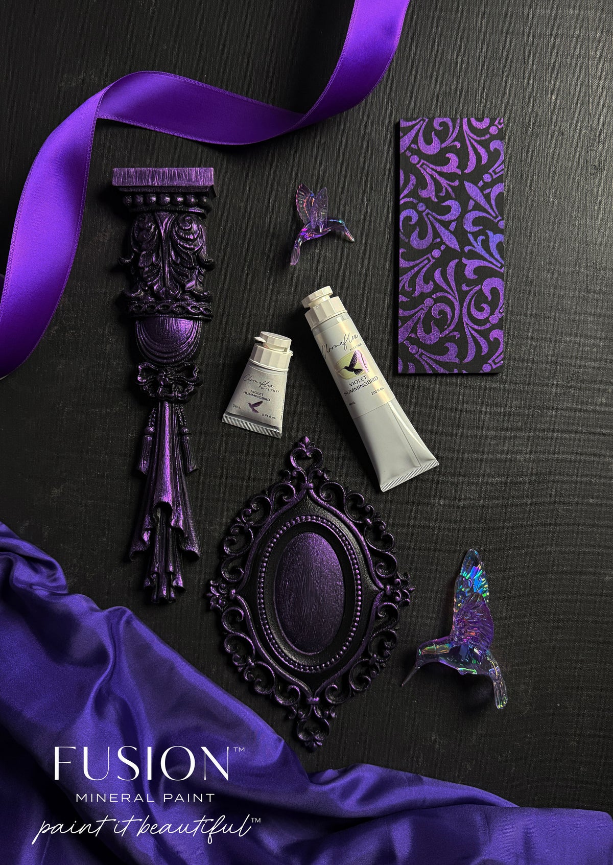 ChromaFlex paint tubes and Fusion Mineral Paint with purple ribbon, ornate items, butterflies, and card.