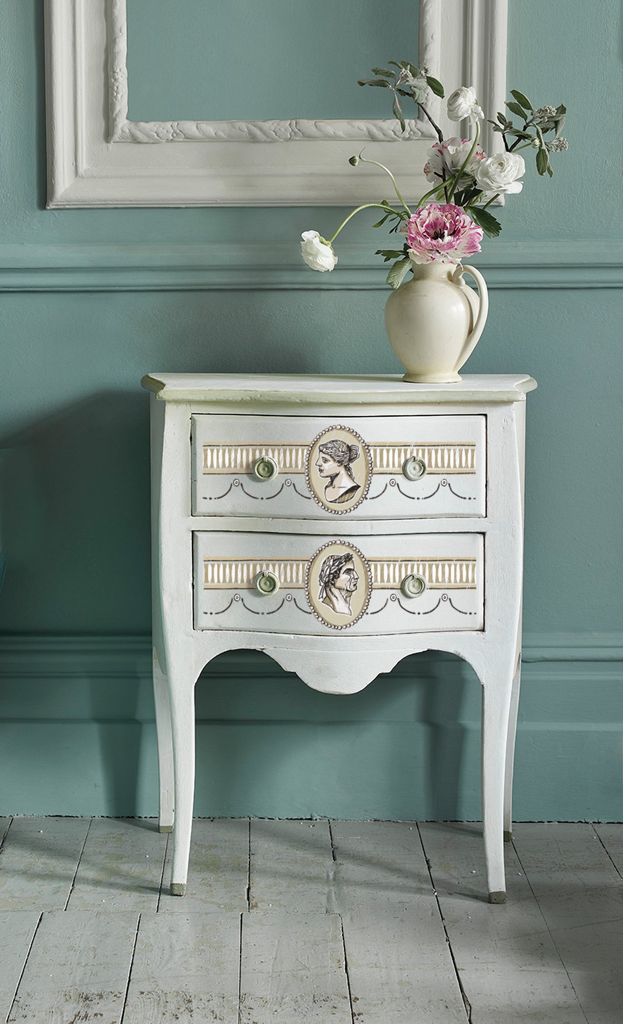 White vintage side table with drawers featuring I.O.D. Classical Cameo Paint Inlay by Annie Sloan.