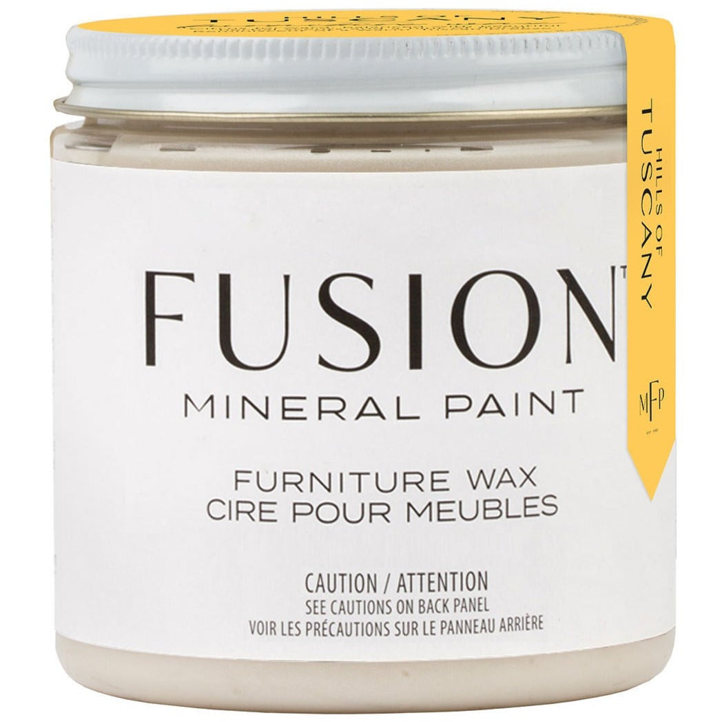 Fusion Mineral Paint Clear Furniture Wax jar with yellow lid and labeled Fusion Mineral Paint.
