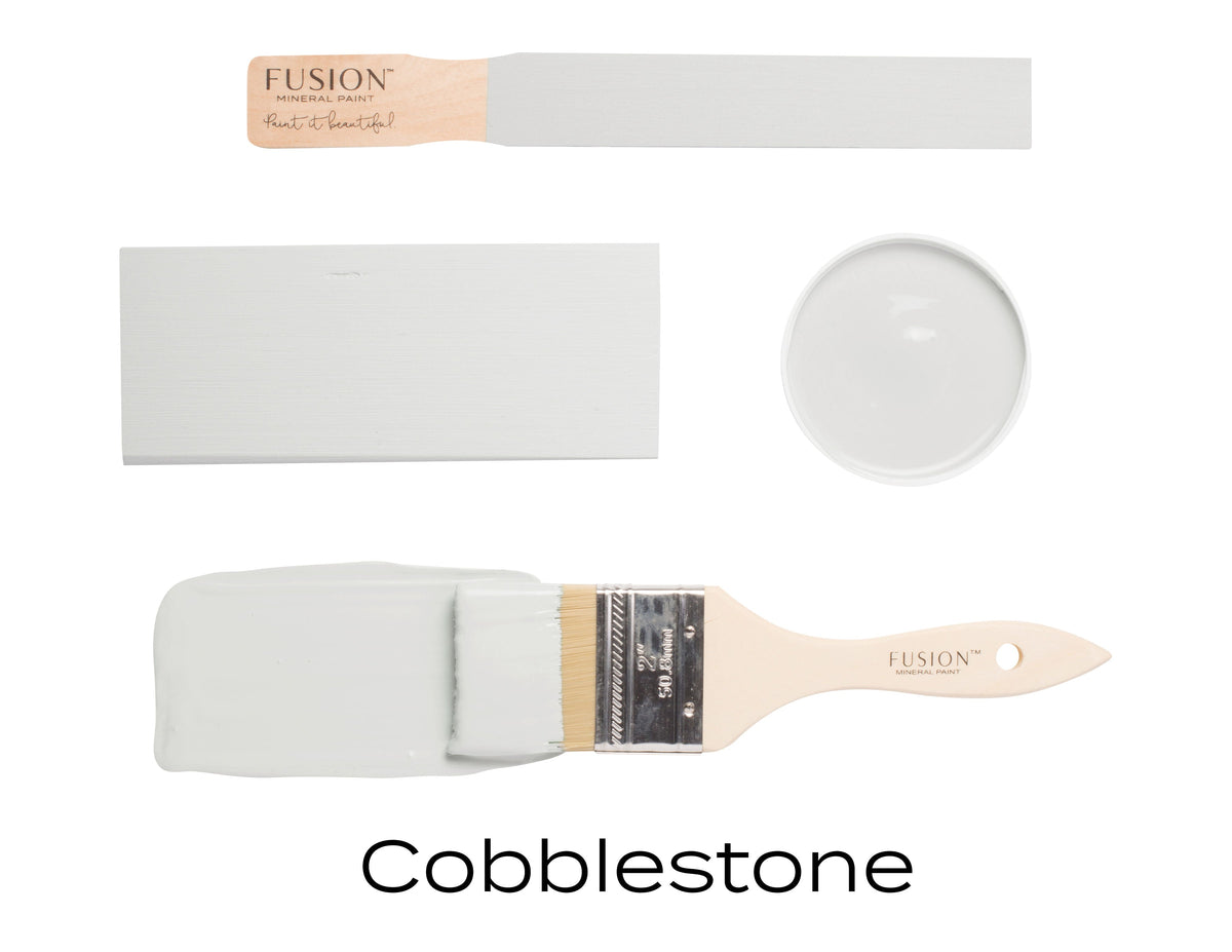 Rectangular swatch, round dish, and brush with warm grey Cobblestone Fusion Mineral Paint by Fusion Mineral Paint.