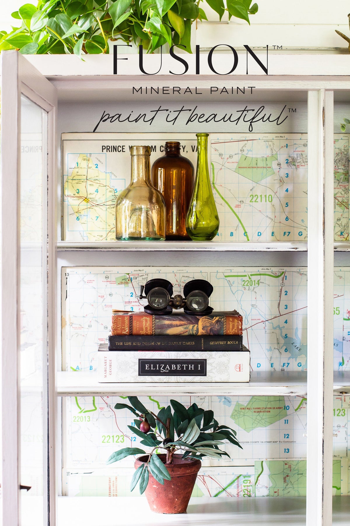 Cobblestone Fusion Mineral Paint shelf displaying glass bottles, vintage binoculars, books, map, and plant.