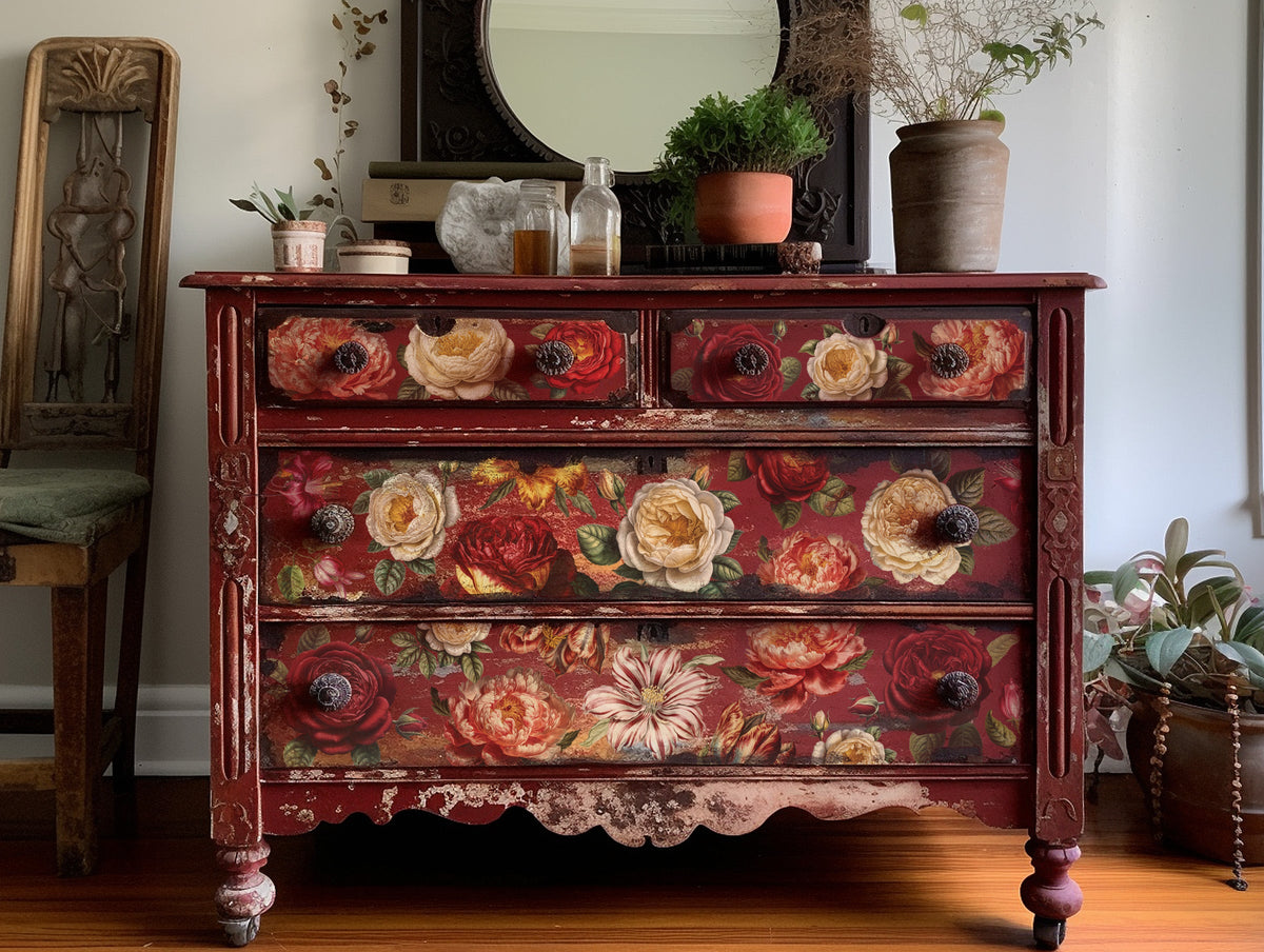 Dresser with Collage De Fleurs Transfer by IOD, topped with plants and a mirror.