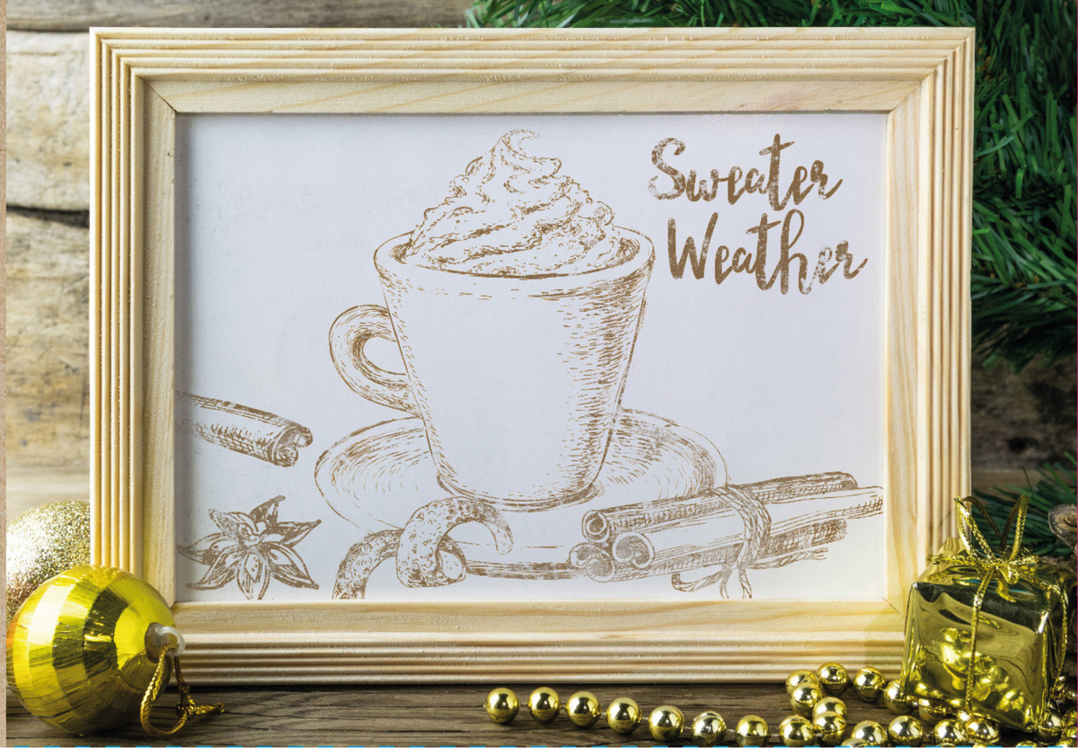 Framed mug sketch with whipped cream, “Sweater Weather,” festive greenery, and I.O.D. Cozy Stamp.