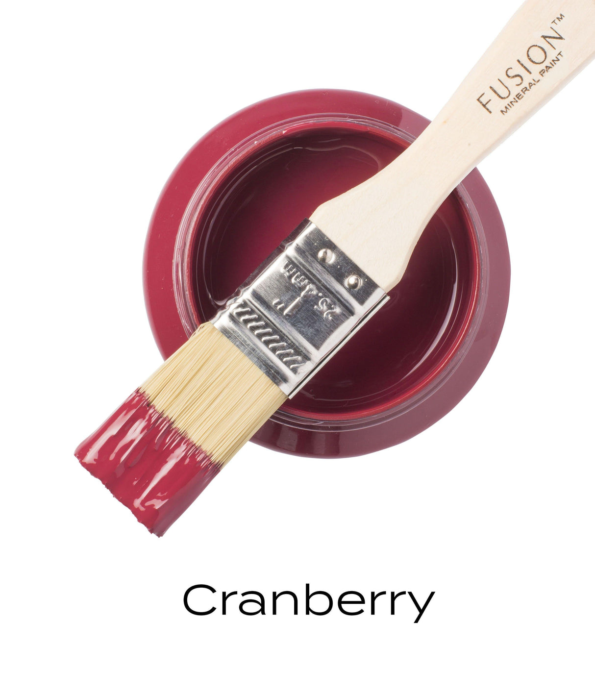 Open can of Fusion Mineral Paint in deep red Cranberry Fusion, brush dipped in, label visible underneath.