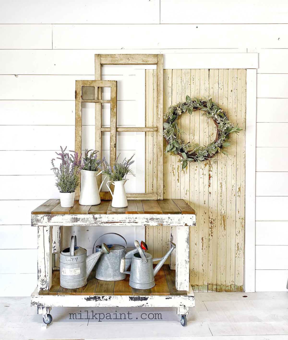 Rustic cart with pitchers, potted lavender, and vintage window frames painted Creamy by Old Fashioned Milk Paint.