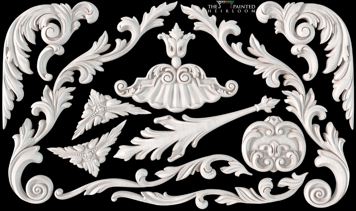 I.O.D. Dainty Flourishes Mould white wood appliques with floral designs on black background.