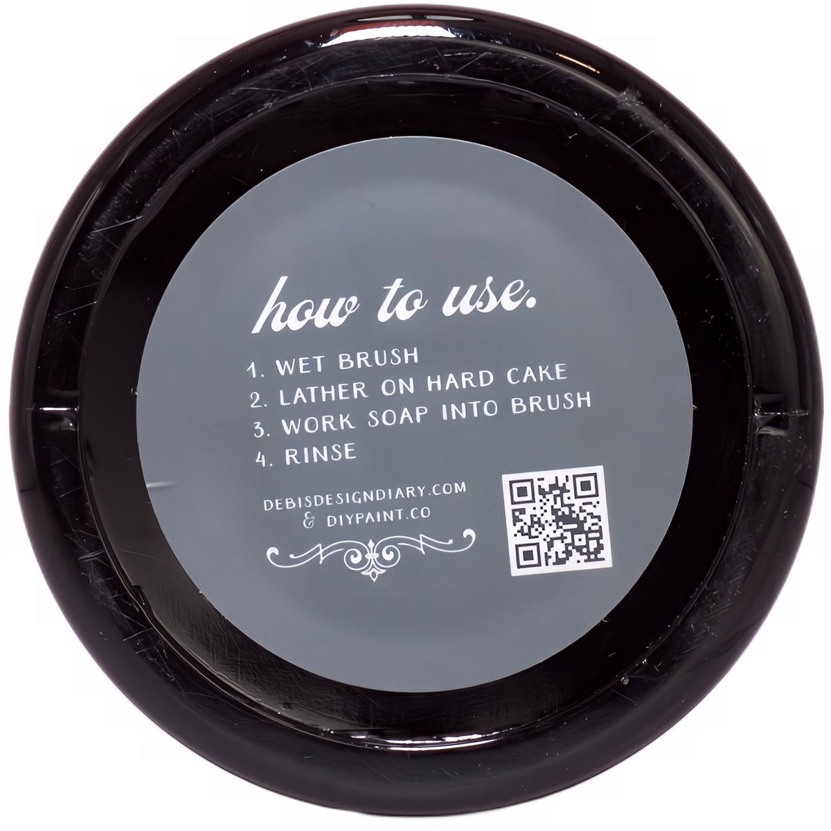 DIY Paint Co. Brush Cleaner lid with wet, lather, rinse instructions and QR code for more details.