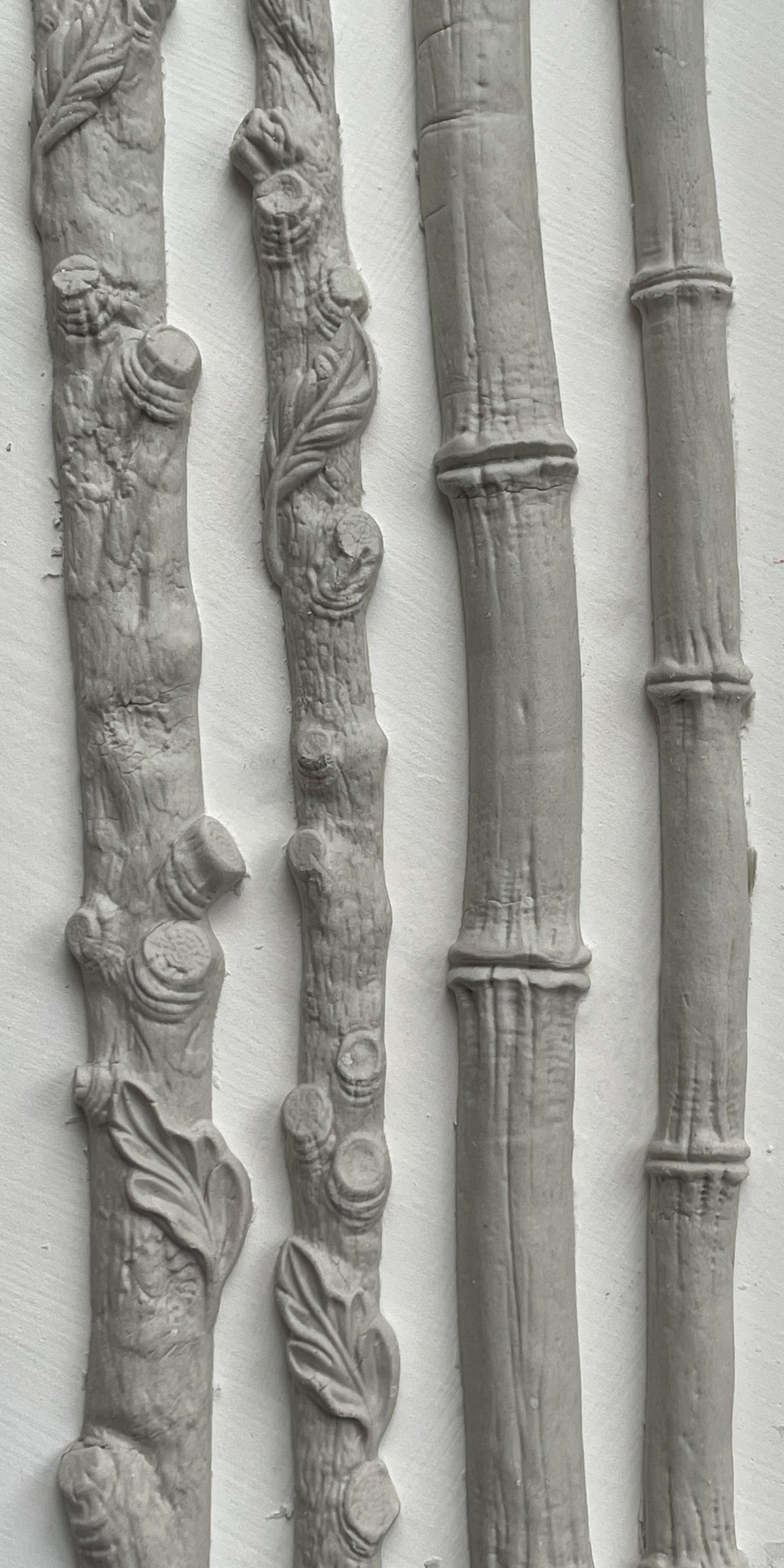 IOD Faux Bois Mould with four gray, bark-textured trim pieces for nature-inspired decorative use.