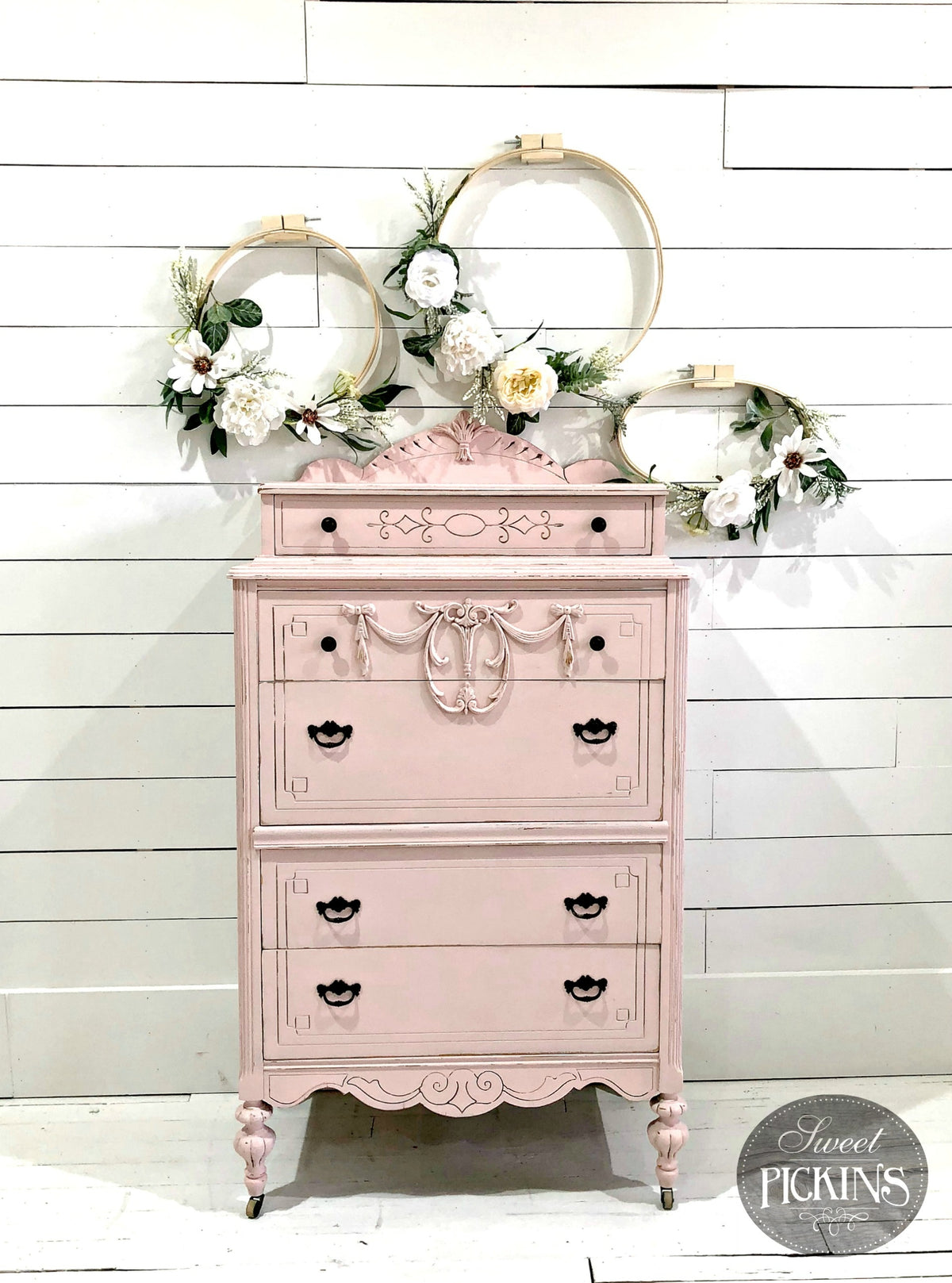 Vintage dresser in First Crush by Old Fashioned Milk Paint, with floral embroidery hoops displayed on top.