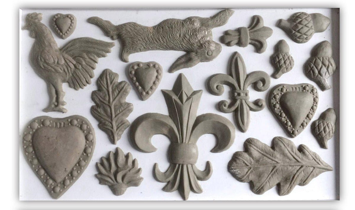 Gray resin hearts, acorns, leaves, and rabbit with I.O.D. Fleur-de-lis Mould by Iron Orchid Designs accents.