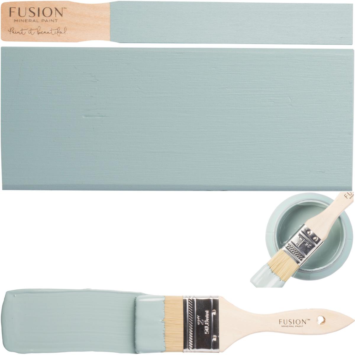 Paintbrush, painted wooden board, and open can of Heirloom Fusion Mineral Paint by Fusion Mineral Paint.
