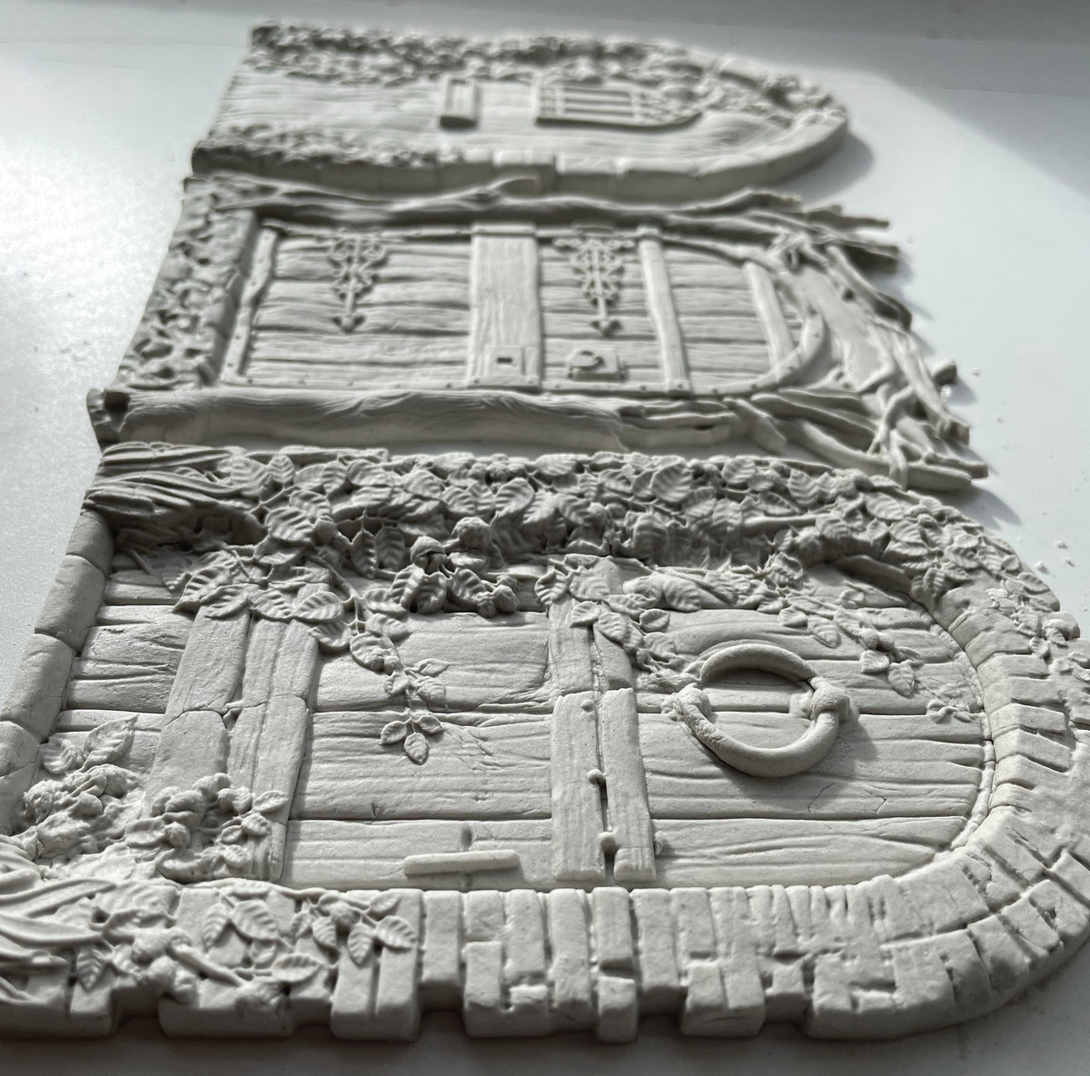 Three clay doors made with I.O.D. Hidden Hollow Moulds using Air Dry Clay.