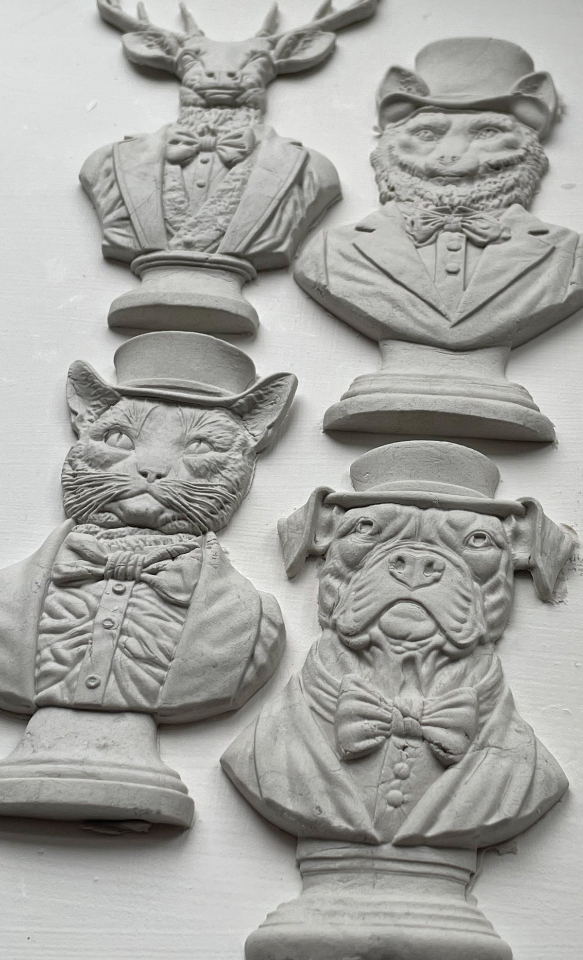 I.O.D. Invitation Only Mould with five animal busts: stag, fox, cat, dog, and whimsical character.