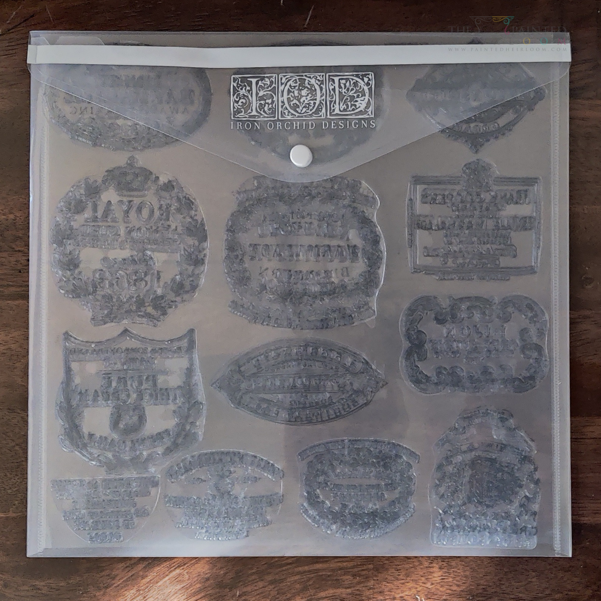 IOD Stamp Storage Envelope with decorative label stamps and IOD branding on front.