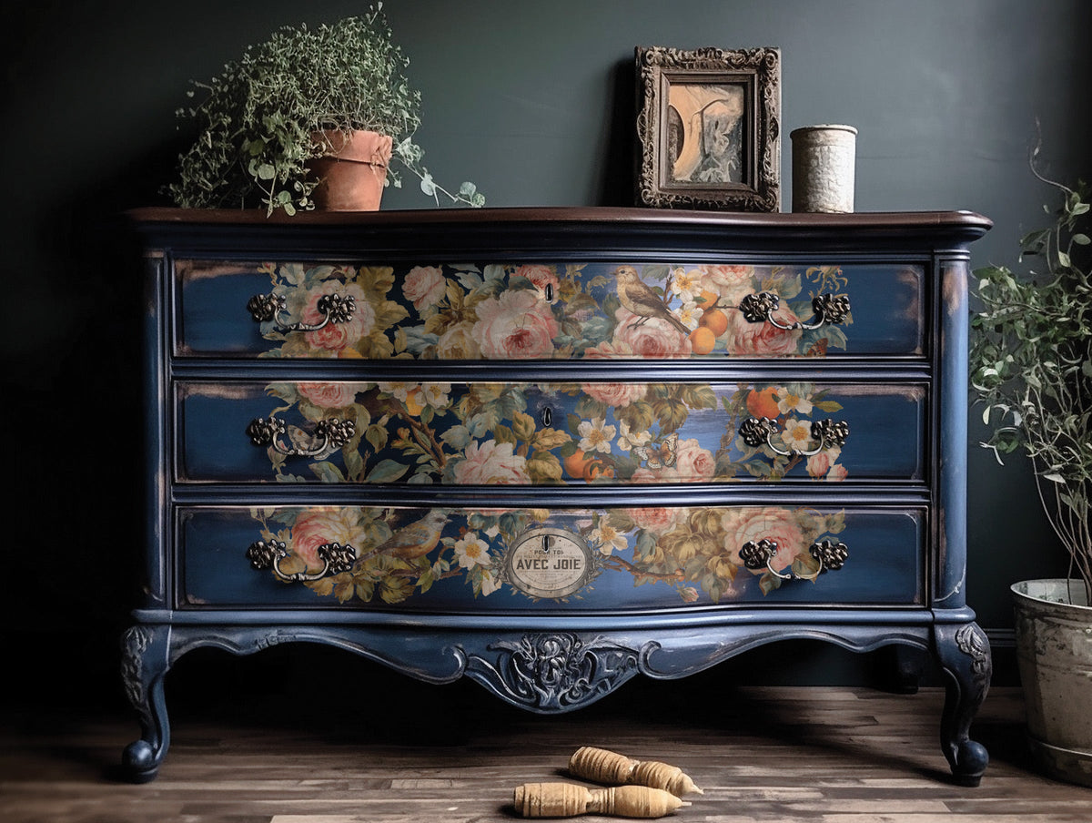 Blue vintage dresser with I.O.D. Joie Des Roses rose motif.
