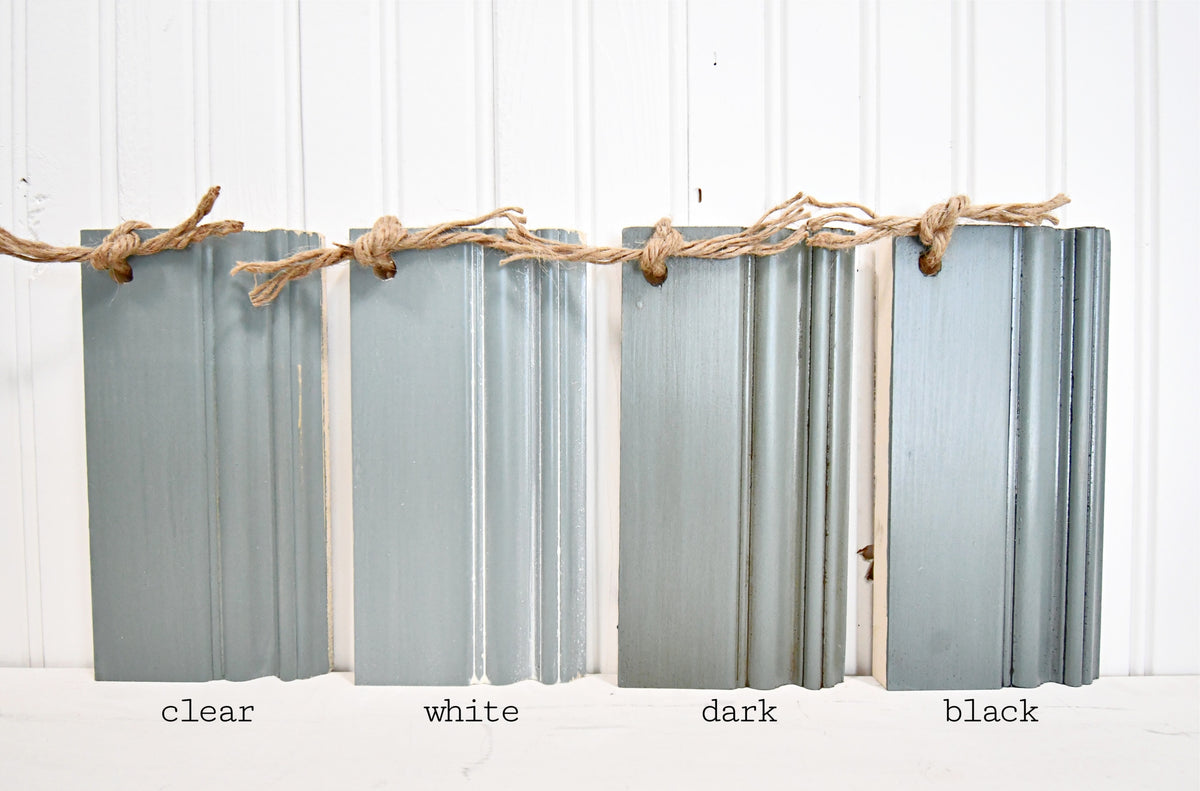 Four trim samples—clear, white, dark, and black—show the Juniper finish from Old Fashioned Milk Paint.