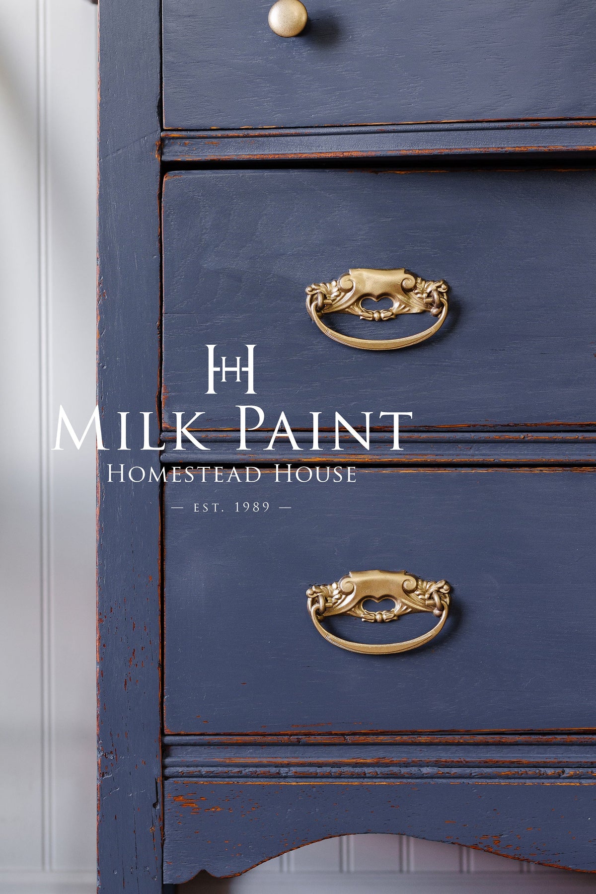 Blue dresser painted with Kurbits Indigo Milk Paint by Homestead House, gold handles, Homestead House overlay.