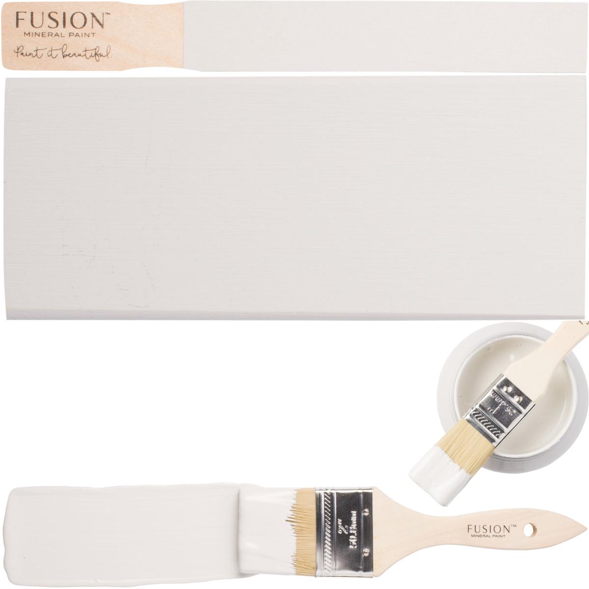 Fusion Lamp White paintbrush, swatches, and can lid grouped together on a white background.
