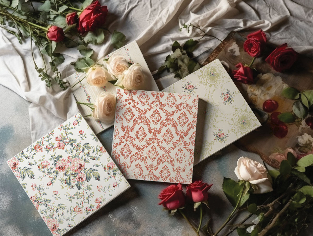 I.O.D. Lattice Rose Paint Inlay cards arranged on vintage wallpaper with rose patterns.