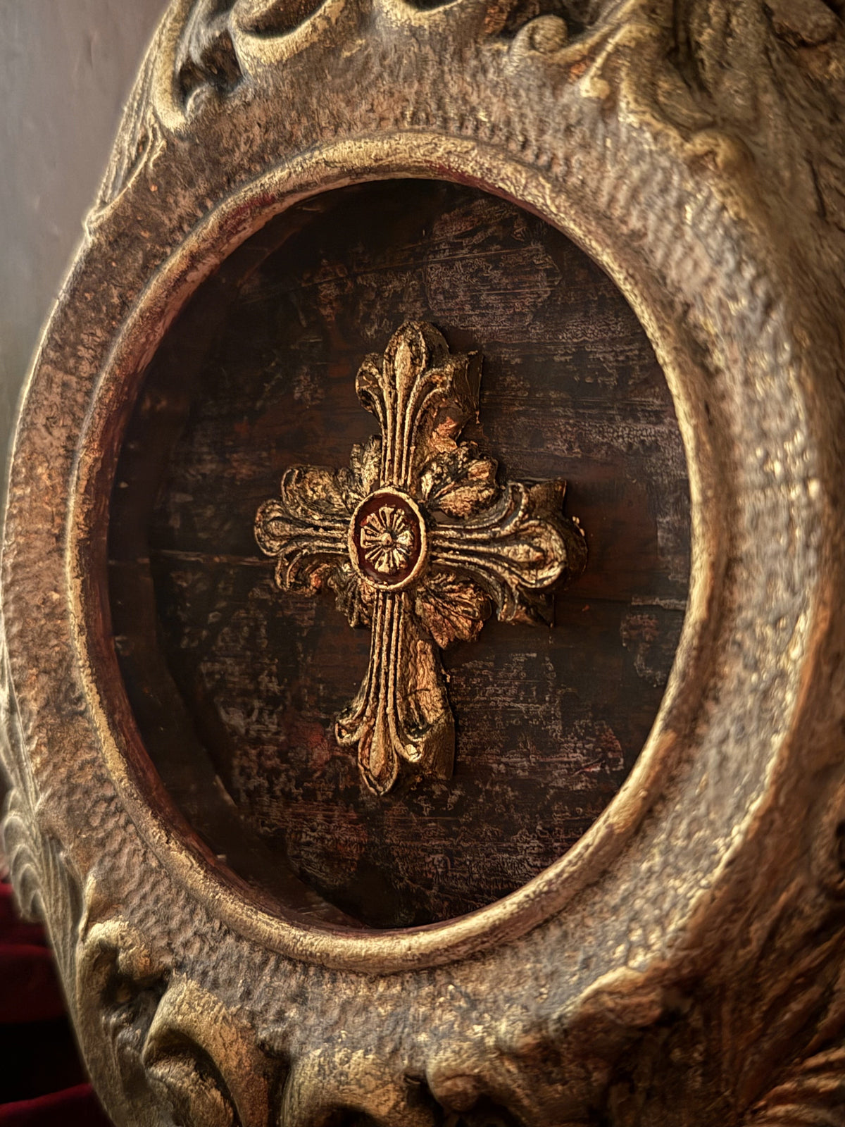 Gold cross made with Les Croix Mould by I.O.D. in rustic wood frame with antique gold trim and ornate detailing.