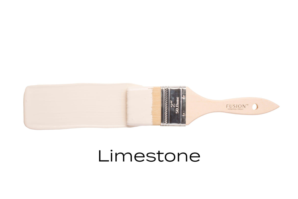 Brush with Fusion Mineral Paint in Limestone acrylic all-in-one shown on a plain white background.