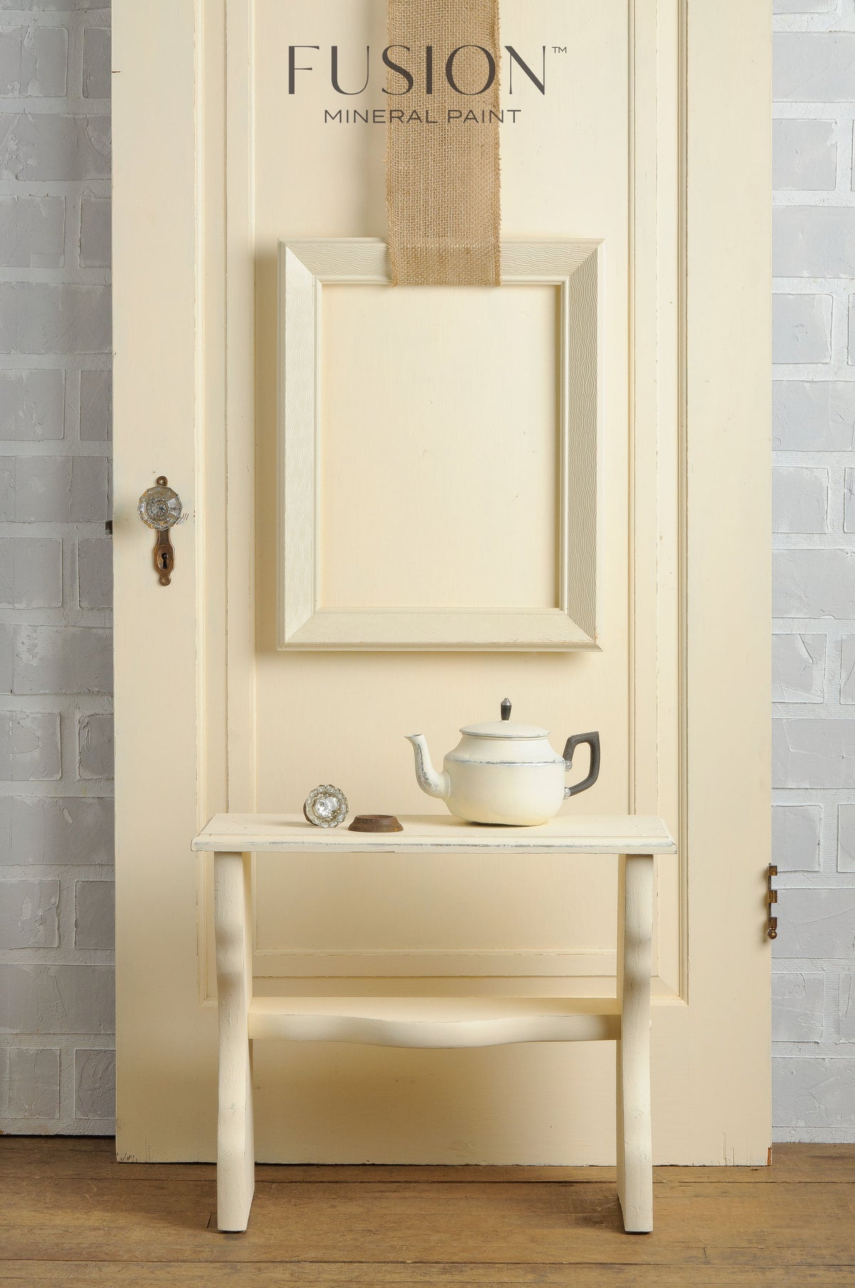 Limestone Fusion Mineral Paint teapot and teacup set by Fusion Mineral Paint on a bench near a cream door.