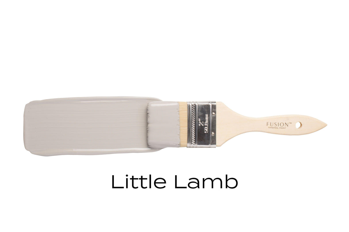 Paintbrush with Fusion Mineral Paint Little Lamb, matte gray color, shown on a white background.