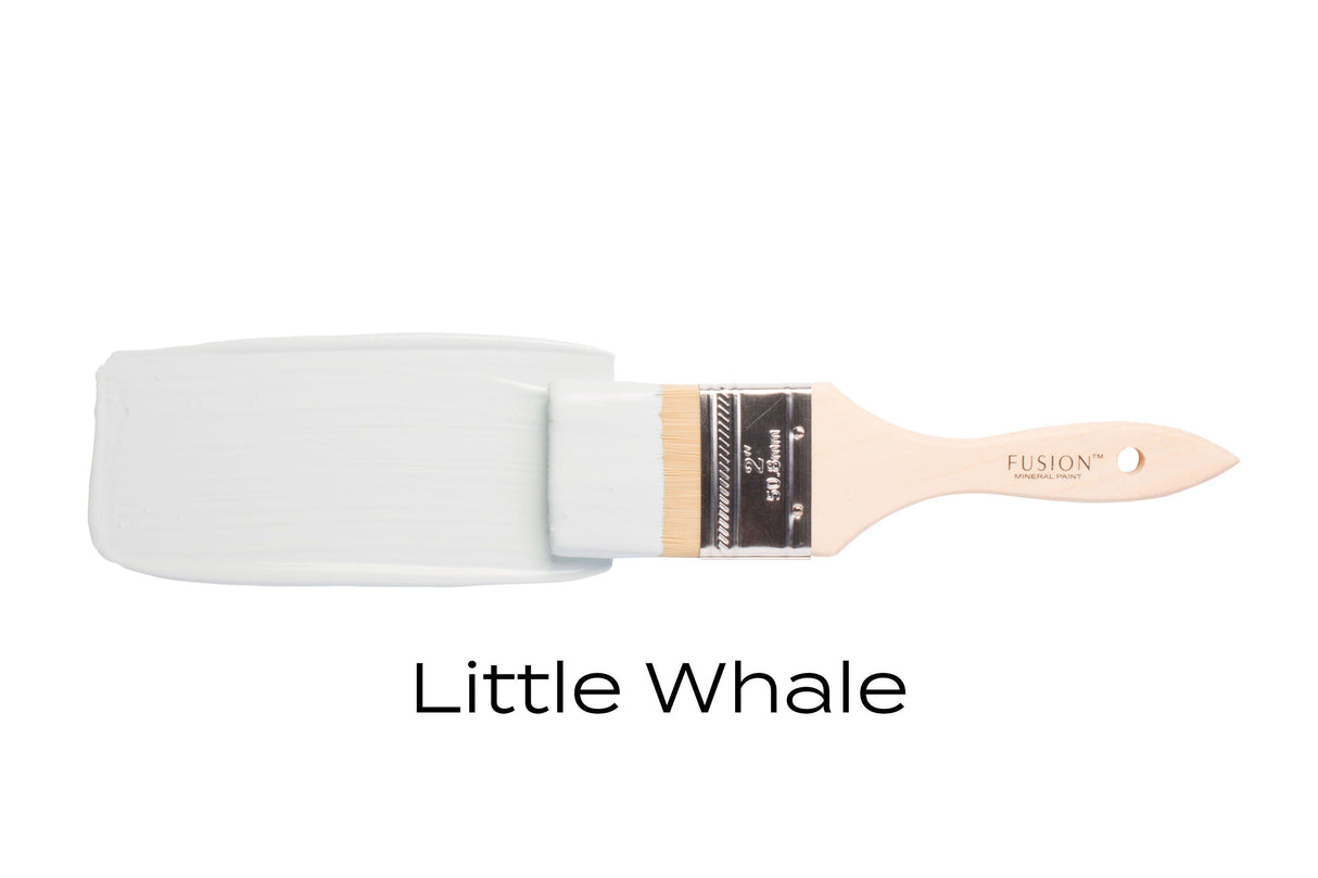 Paintbrush with Little Whale Fusion Mineral Paint by Fusion Mineral Paint against a white background.