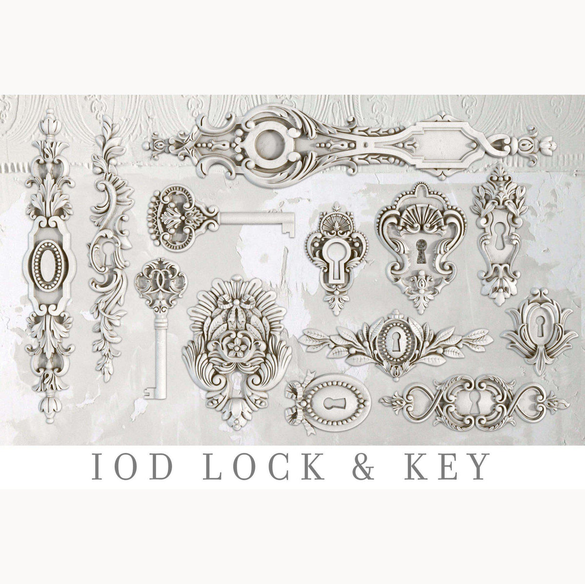 IOD Lock and Key Mould, ornate white and silver embellishments with I.O.D. logo on light background.
