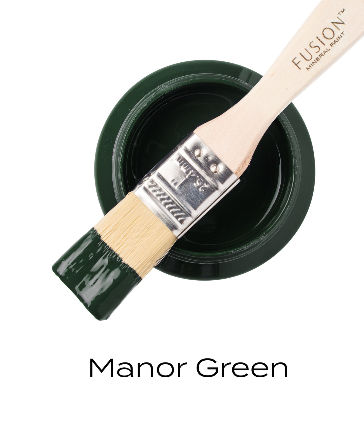 Open jar of Manor Green Fusion Mineral Paint with brush resting on top; text below reads “Manor Green.”.