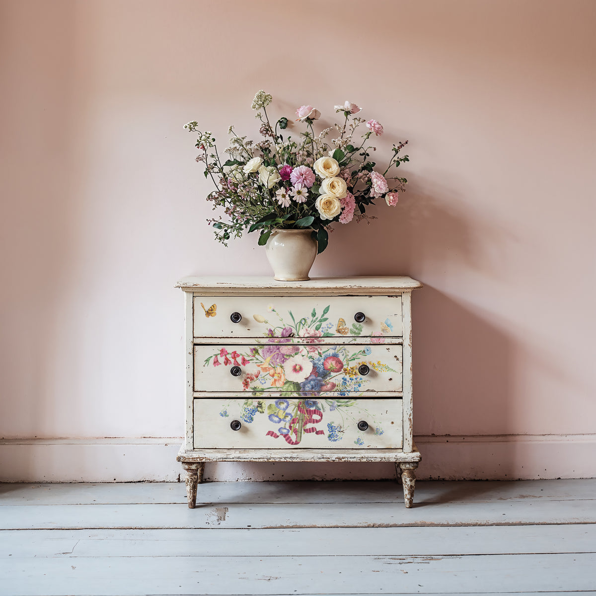Small dresser featuring I.O.D. Marché des Fleurs Transfer, topped with flowers.