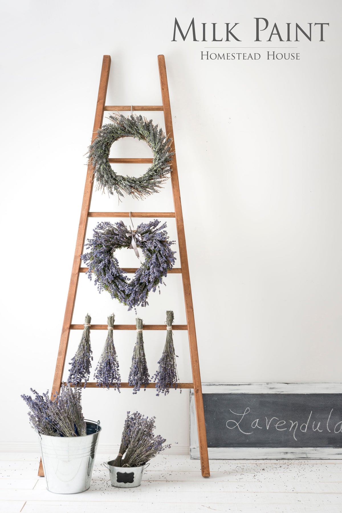 Wooden ladder finished with Fusion Mineral Paint Mixable Milk Paint Wood Stain, holding bundles of lavender.