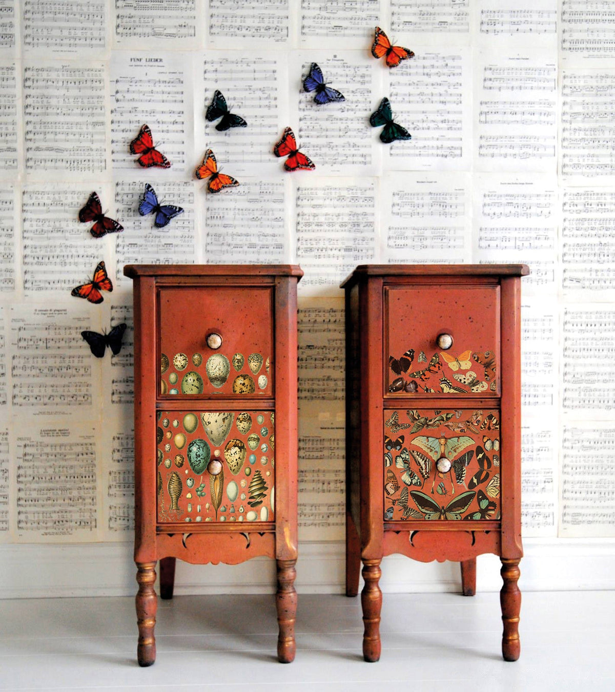 Two painted nightstands featuring I.O.D. Millot’s Pages Transfer and butterfly accents against sheet music.