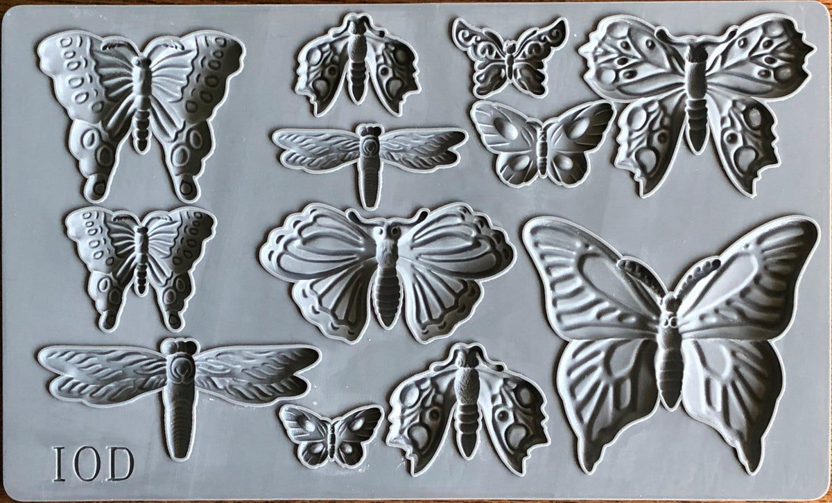 I.O.D. Monarch Mould: gray silicone tray with butterfly, moth, and dragonfly shapes by Iron Orchid Designs.